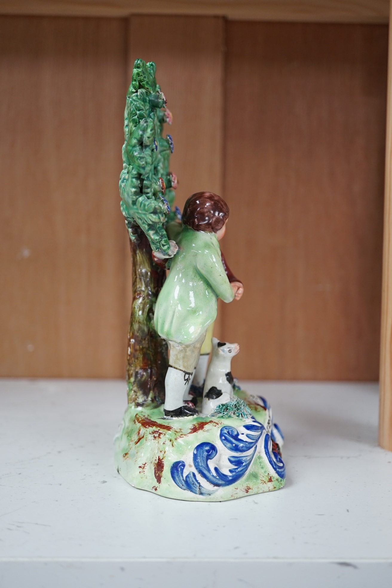 An early 19th century Walton pearlware ‘friendship’ bocage group, 20.5cm high. Condition - some restoration and repainting to enamels, otherwise in reasonable condition